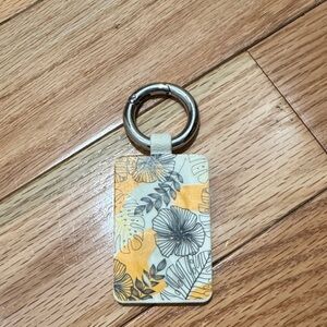 Floral Bagnet Keychain with Yellow and Gray Design